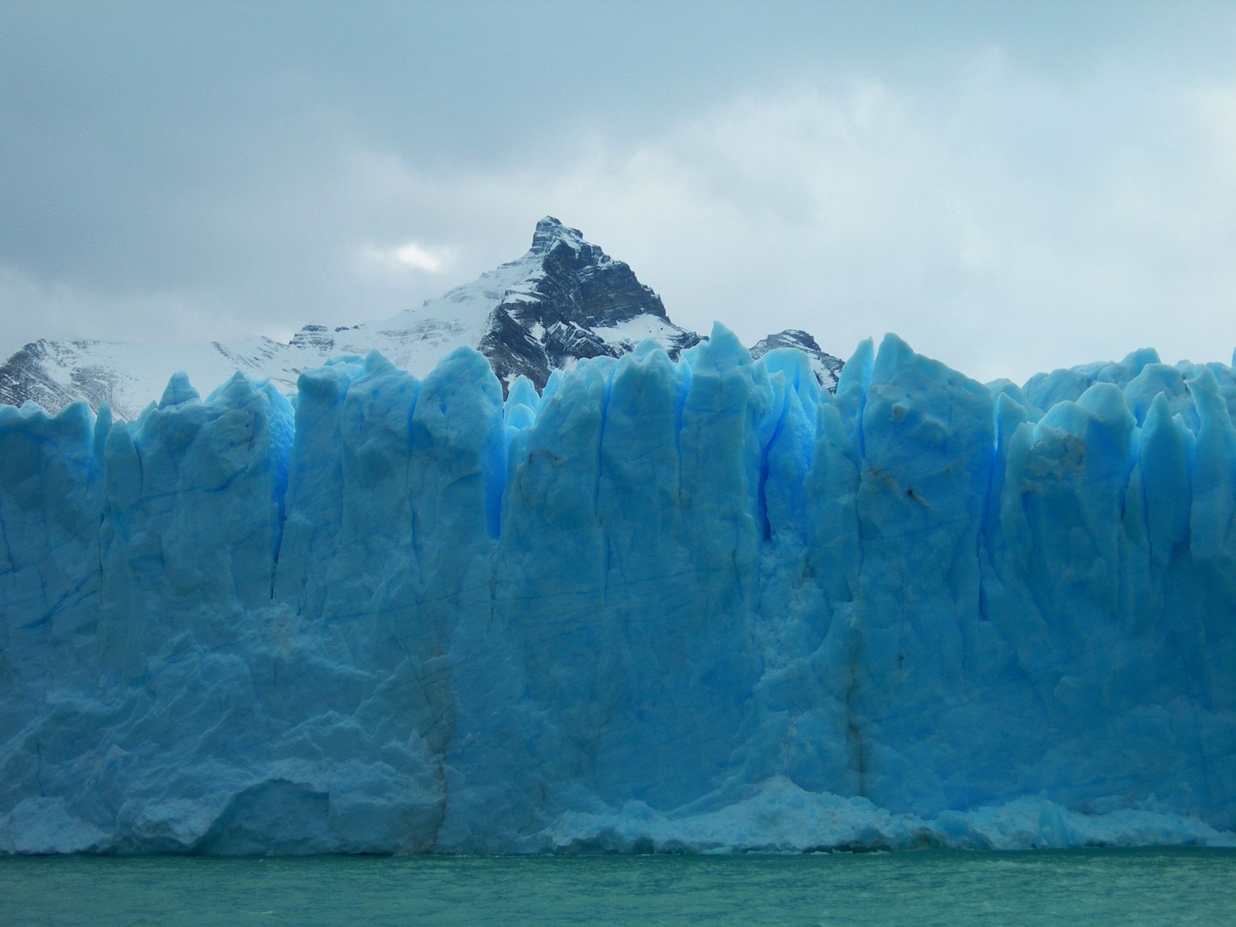 Patagonian mountain ridge and turquoise glacial lake